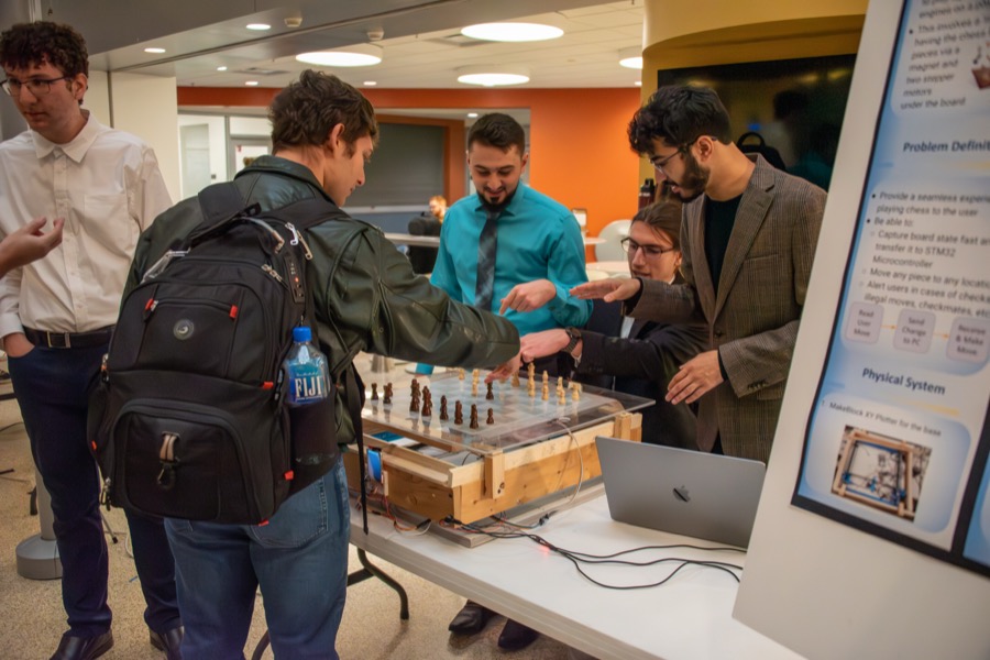 Teams demonstrating their projects at the EECS 373 Embedded System Expo, photo 6