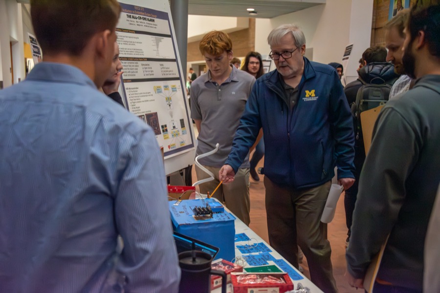 Teams demonstrating their projects at the EECS 373 Embedded System Expo, photo 9